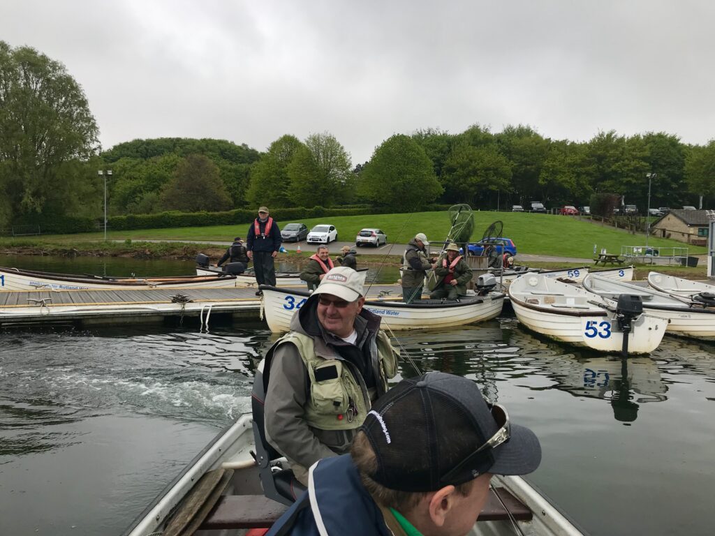 Fly fisherman ready for a days fishing on a boat