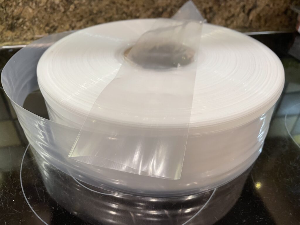 A roll of plastic packing tube